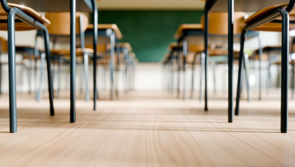 Empty Classroom with desks and chairs.