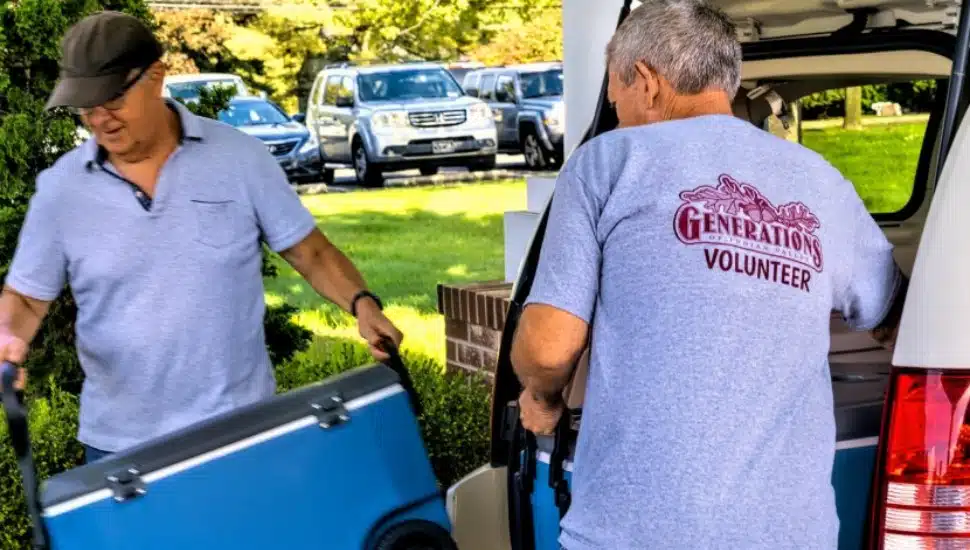 Two volunteers unload food with Generations if Indian Valley.