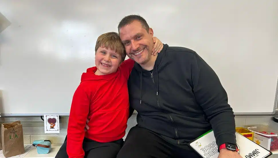 Steve DeLong hugs son Bradley.