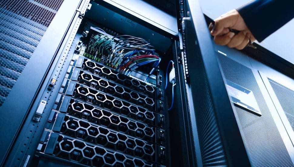 A close-up view of a server rack in a modern data center, showcasing neatly organized cables and advanced hardware.