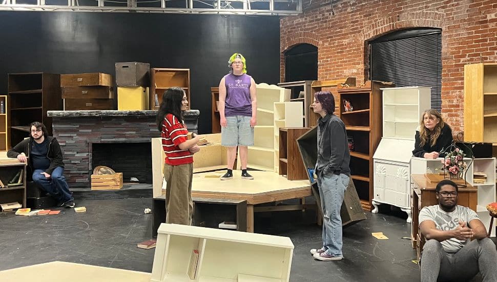 Alex Voss, Nayla Garcia, Autumn Sherry, Star Gies, Chrissy McGuinness and Juleon Gibson rehearse a scene from “The Library at the End of the World” on Montgomery County Community College’s Pottstown Campus. The cast is performing in the play’s world premiere April 23-26.