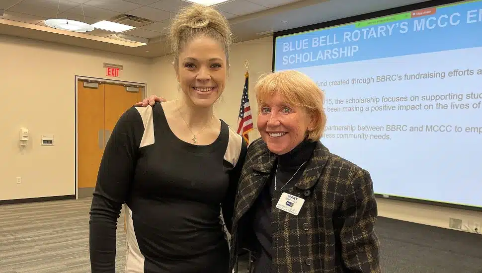 Susie Delp stands with Rotary Club of Blue Bell President Mary Vila after receiving a scholarship at Montgomery County Community College event.