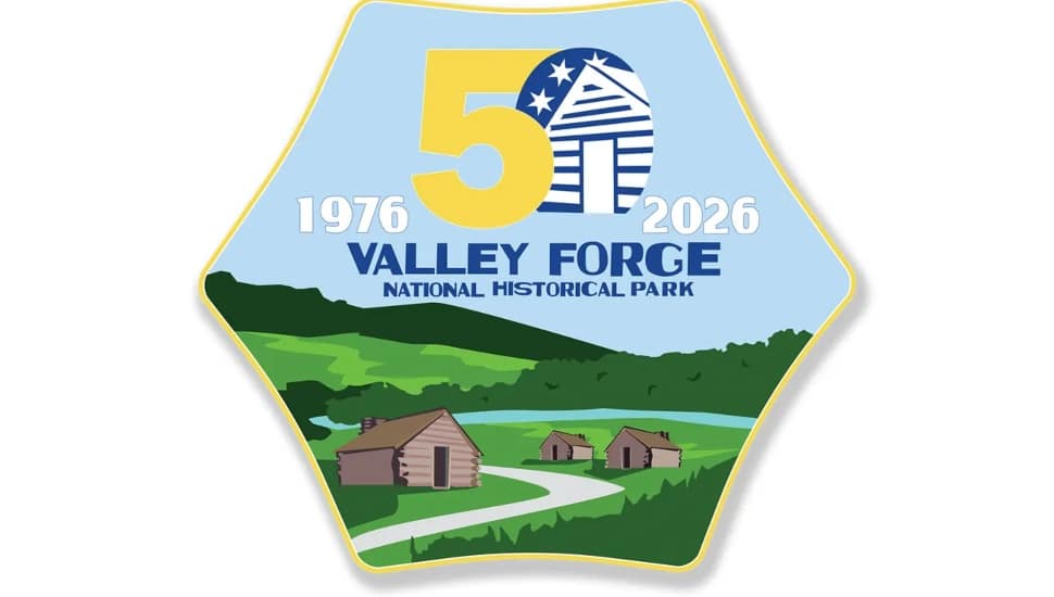 Official 50th anniversary logo for Valley Forge National Historical Park, featuring the years 1976–2026, a large "50" in gold, and an illustrated landscape of historic log cabins and rolling green hills.