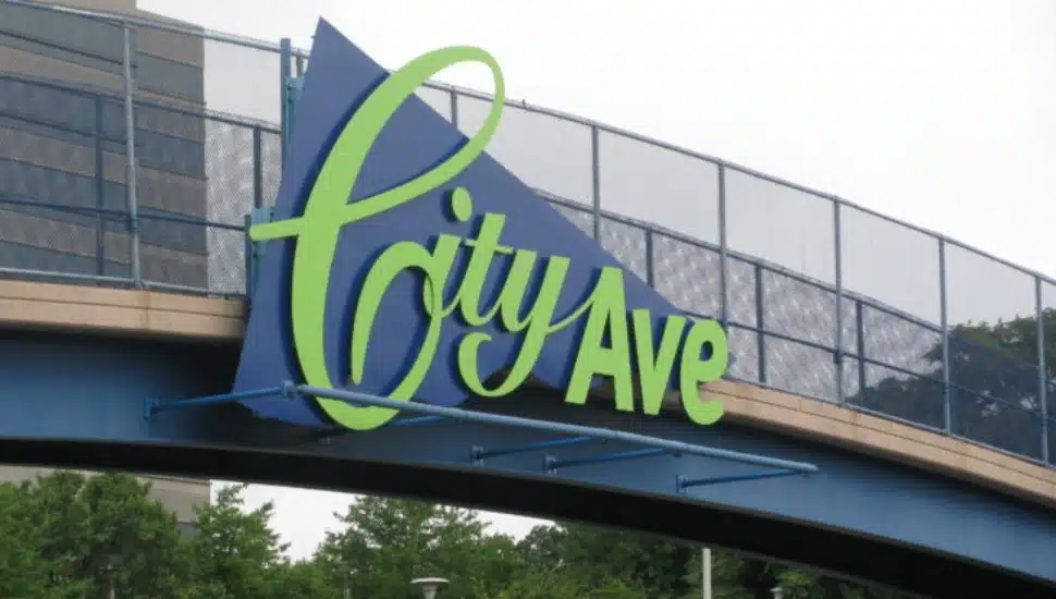 The famed 'City Ave' sign hangs on a walking bridge in Bala Cynwyd.