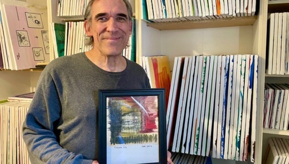 Mark Smith holds one of the 400 piece he has painted over the last 2 years