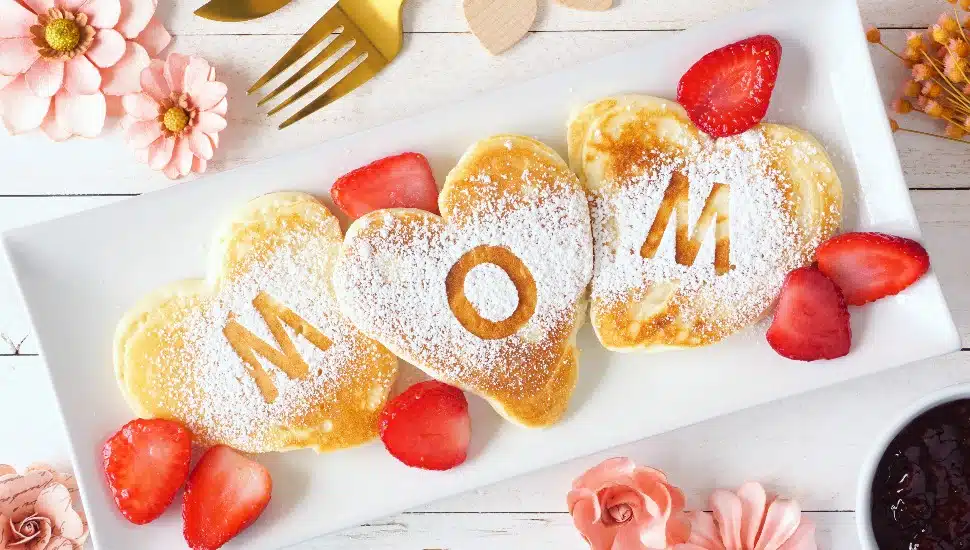 Heart shaped pancakes with MOM letters.