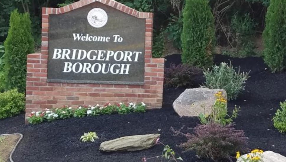 A 'Welcome to Borough of Bridgeport' sign sits above a manicured garden.