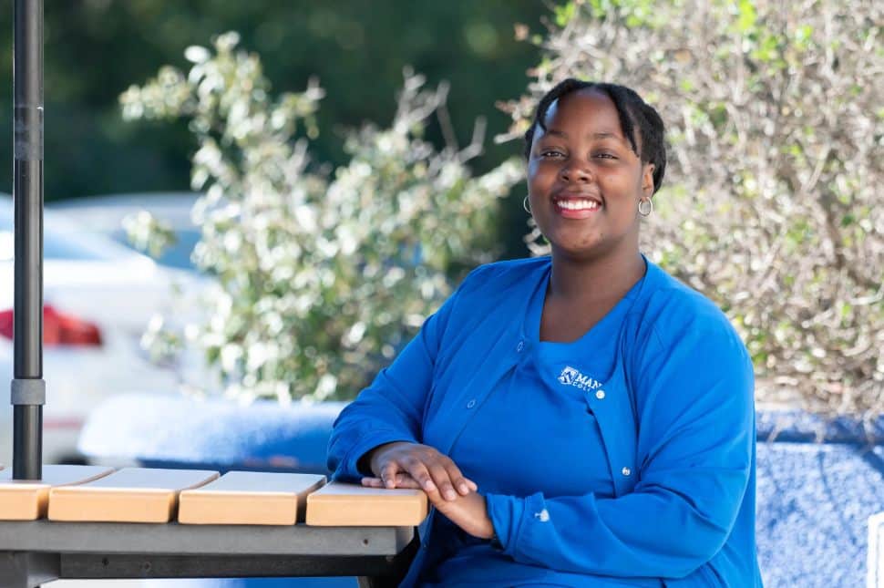 Michelle Henderson, Manor College Practical Nursing graduate, poses for a portrait on campus in 2026.