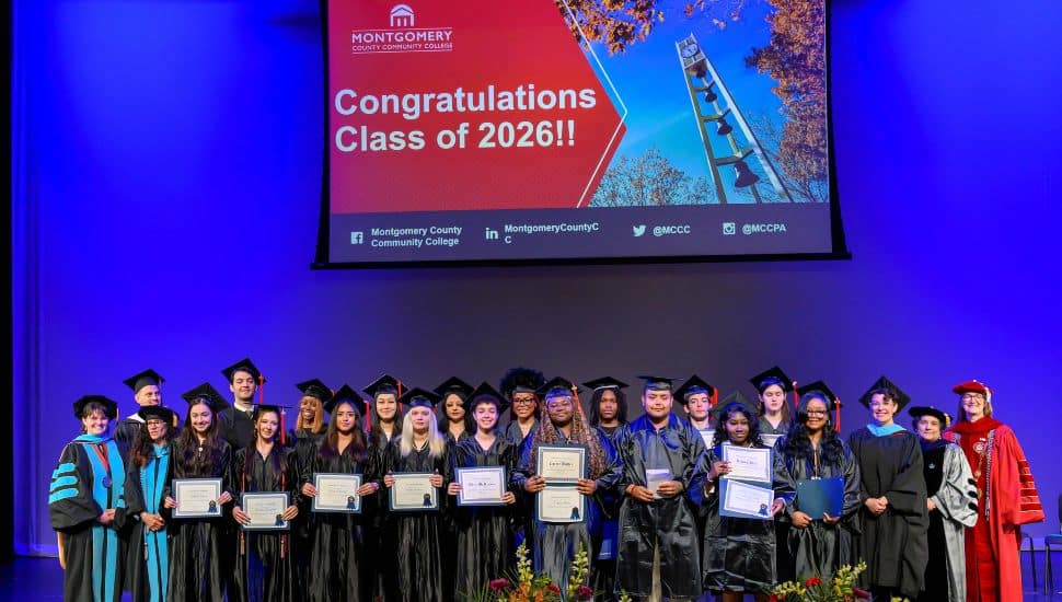 Students of MCCC stage in caps and gowns.
