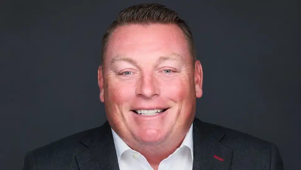 Headshot of middle-aged male wealth management executive.