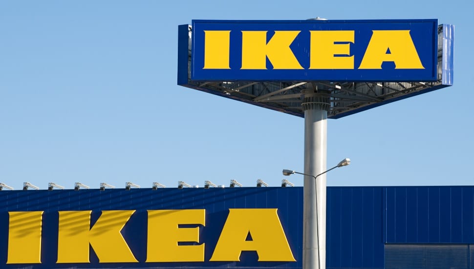 An IKEA sign stands high above the store for all traffic to see.