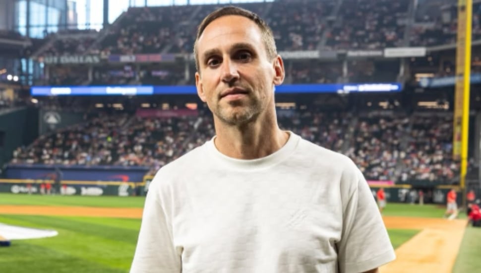Michael Rubin stands on the baseball diamond.
