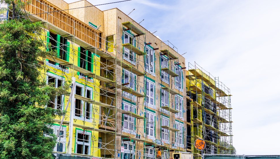New and modern, multilevel apartment complexes are being built under construction.