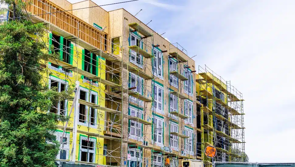 New and modern, multilevel apartment complexes are being built under construction.