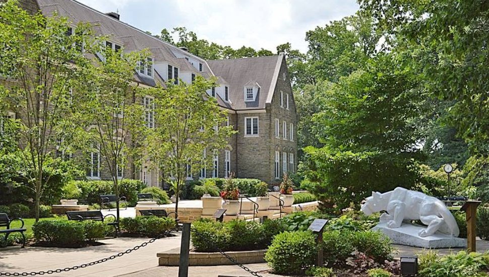 A staute of the NIttany Lion overlooks Penn State's Abington campus.