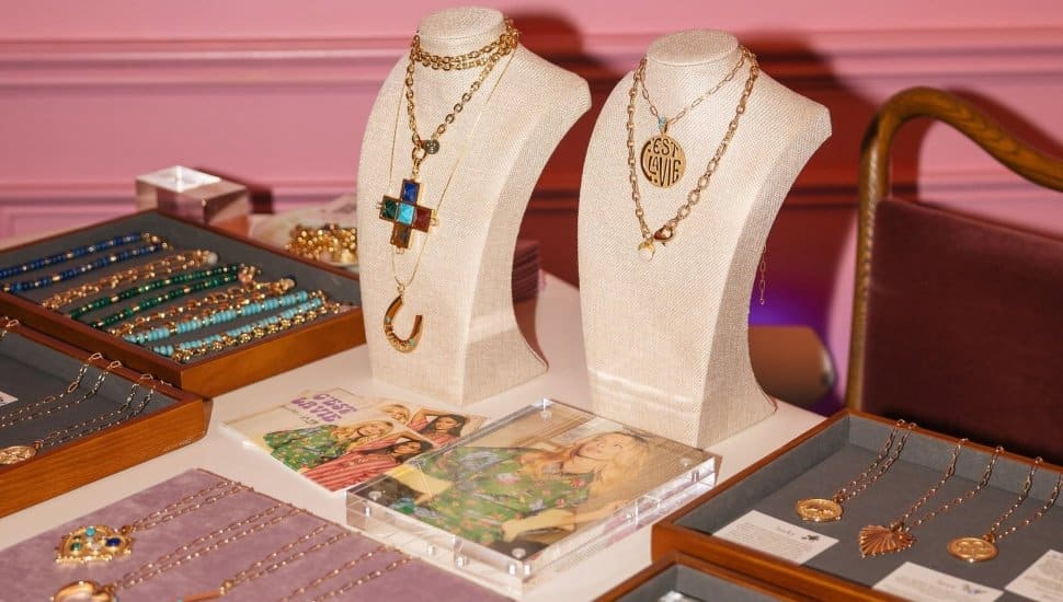 Jewelry holders with necklaces and bracelets on display.