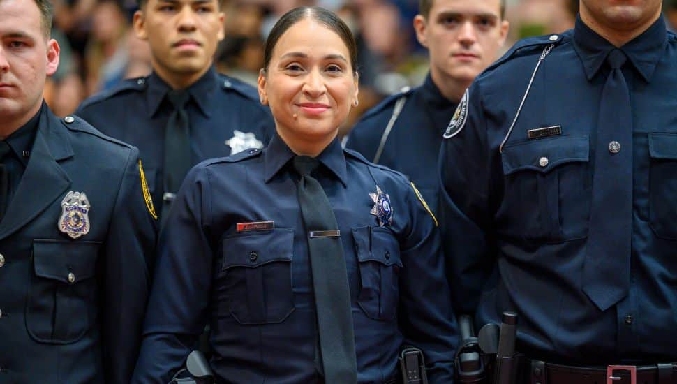 Montgomery County Community College Municipal Police Academy cadet Emily Figueroa smiles during the program’s graduation ceremony June 10.