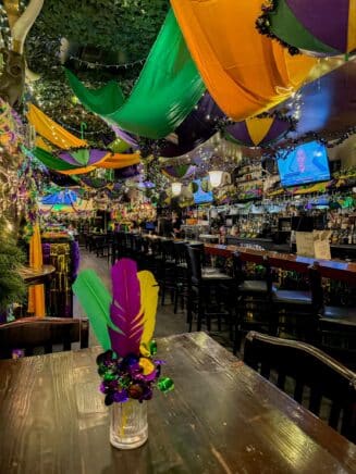 Glimpse of the inside of Craftsman Row Decorated for Mardi Gras
